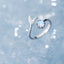 Adjustable ring with dolphin tail made of sterling silver and blue zirconium dioxide